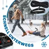A man is pulling a woman on a sled through a snowy forest, with deer in the background. The image also shows a close-up of a rope and handle, and a car trunk with items. Produktbild-Vorschau