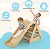 Two children playing on a wooden climbing triangle with a slide indoors. Voir les images du produit