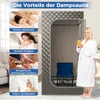 A woman in a bathrobe holds a glass of orange juice next to a portable steam sauna. The image also features four smaller inset images illustrating the benefits of the sauna. Anteprima dell’immagine prodotto