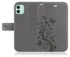 A gray flip case for an iPhone 11 with a butterfly and floral design. Produktbild-Vorschau