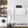 A laundry room scene with a washing machine, shelves, and a drying rack. Náhled obrázku produktu