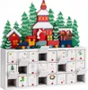 A wooden advent calendar shaped like a Christmas village with a train, trees, and Santa Claus. Produktbild-Vorschau