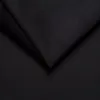 A close-up view of black fabric, folded to create shadows and highlights. Produktbild-Vorschau