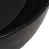 A close-up view of the edge of a black ceramic sink. Podgląd zdjęcia produktu