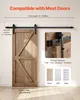 A barn door sliding hardware kit is shown installed on a wall next to a wooden barn door. Dimensions and compatibility information are overlaid on the image. Podgląd zdjęcia produktu