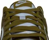 A close-up view of the top of a Nike Dunk Low Retro sneaker, focusing on the laces and the Nike logo on the tongue. Produktbild-Vorschau