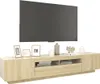 A modern TV stand with a television on top and decorative items on the surface. Anteprima dell’immagine prodotto
