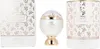 A perfume bottle and its packaging are displayed on a white background. Voir les images du produit