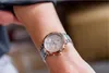 A close-up shot of a woman's arm wearing a Tommy Hilfiger watch. Náhľad obrázku produktu