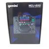 The image shows the front of a product box for a Gemini MDJ-600 DJ Media Player. Voir les images du produit