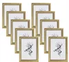 A collection of gold picture frames arranged in a staggered pattern against a white background. Produktbild-Vorschau