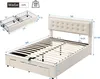 A white upholstered bed frame with a tufted headboard and a slatted mattress support is shown with dimensions indicated by measurement lines and numbers. A separate diagram shows two storage baskets with dimensions. Anteprima dell’immagine prodotto