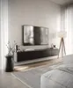 A modern living room with a wall-mounted TV and media console. Produktbild-Vorschau