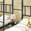 Close-up view of a bunk bed with bedding, a lamp, and a teddy bear. Náhled obrázku produktu