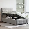 A bed with its storage compartment open, revealing the mattress and frame, in a bedroom setting. Náhľad obrázku produktu