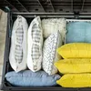 A storage box filled with pillows and cushions. Produktbild-Vorschau