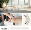 A collage showing a massage table in a bright room, a close-up of a massage being performed, and a diagram of a headrest. Náhled obrázku produktu