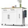 A white kitchen island with a wooden top, on wheels, with decorative items on top. Voir les images du produit