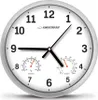 A close-up of a white analog wall clock with a thermometer and hygrometer. Produktbild-Vorschau