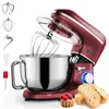 A red stand mixer with various attachments shown, along with bread slices and a tart. Produktbild-Vorschau