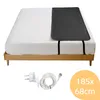 A heated mattress pad and its accessories on a bed. Produktbild-Vorschau