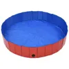 A round, collapsible dog pool with red sides and a blue interior. Náhľad obrázku produktu