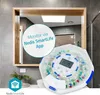 A smart pill dispenser is shown in a bathroom setting, with a mirror reflecting the room. Anteprima dell’immagine prodotto