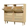 A wooden shoe cabinet with rattan accents and open flip-down drawers. Podgląd zdjęcia produktu