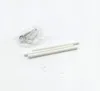 A collection of hardware components, including screws and white rods, laid out on a white surface. Podgląd zdjęcia produktu