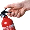 A hand is holding a red fire extinguisher. Produktbild-Vorschau
