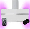 A white range hood with a silver accent strip, shown with a smartphone displaying a 'SMART APP' interface and two charcoal filters. The background is a gradient of pink. Produktbild-Vorschau