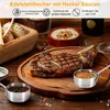 A close-up of a steak on a wooden board, with small sauce cups and bread in the background. Produktbild-Vorschau