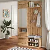 A hallway or entryway with a wooden furniture set including a mirror, bench, and storage. Voir les images du produit