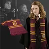 A model wearing a Gryffindor scarf and robe, with a separate scarf shown in the foreground. Náhled obrázku produktu