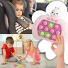 A collage showing children in a car seat, a pop-it toy, and children playing with blocks. Produktbild-Vorschau