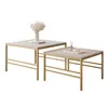 Two nesting coffee tables with gold metal frames and light gray tops, displayed on a white background. Voir les images du produit