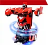 A red robot toy that can transform into a car, shown in robot mode with blue light effects around its base. Produktbild-Vorschau