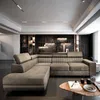 A modern living room with a sectional sofa and decorative wall. Produktbild-Vorschau