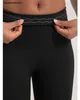 Schwarze Shapewear-Leggings mit wellig strukturiertem Bund, von Händen gezogen, um die Elastizität zu zeigen Náhled obrázku produktu