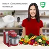 A woman is smiling in front of a kitchen counter with a red stand mixer and a pile of fresh vegetables. Produktbild-Vorschau