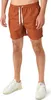 A person is wearing shorts and sneakers. Náhled obrázku produktu