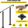 A marketing image showcasing a black wrought iron handrail with text highlighting its features and benefits. Podgląd zdjęcia produktu
