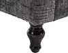A close-up of the leg and bottom of a sofa. Produktbild-Vorschau