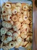 A close-up view of a tin filled with various types of cookies. Anteprima dell’immagine prodotto