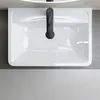 A top-down view of a white sink with a black faucet. Produktbild-Vorschau
