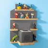 A wall-mounted shelf unit displaying various small figurines and a gray cube-shaped speaker. Produktbild-Vorschau