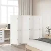 A white room divider is set up in a bedroom, partially obscuring a desk and window. Produktbild-Vorschau