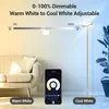 A floor lamp is shown in a living room setting, with a sofa and a plant. The image also displays a smartphone app interface for controlling the lamp's lighting. Produktbild-Vorschau
