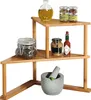A multi-tiered bamboo corner shelf holding various kitchen items like jars, bottles, and a mortar and pestle. Produktbild-Vorschau