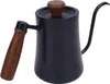 A black gooseneck kettle with a wooden handle and lid knob, isolated on a white background. Podgląd zdjęcia produktu